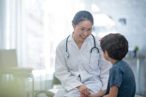 child psychologist checking on young boy