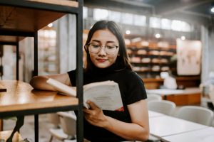 female student searching for books