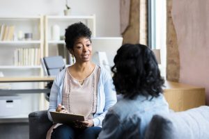 mature woman talking with therapist