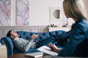 man visiting female counselor